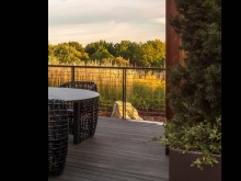 Strategically placed boulders, hand selected from the owners quarry, reinforce "Genius Loci" connecting the rooftop garden to the owner’s origins in northeast Ohio.