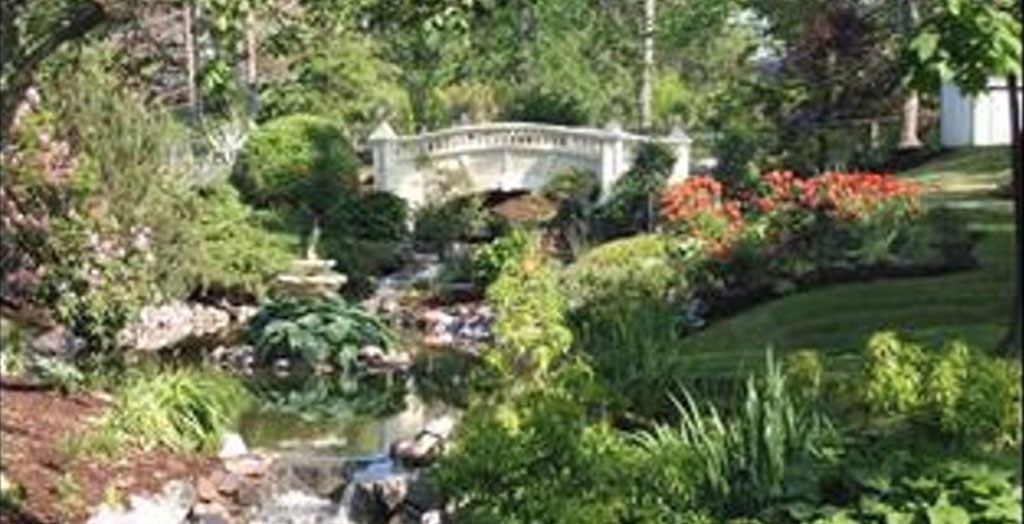 Victorian garden with fountain and bridge