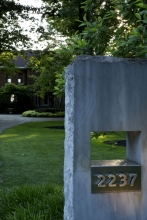Capturing the edge of contrast between modernism and the patina of the historic property, the reclaimed foundation stones were pierced with openings sized through sacred geometry.