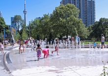 The interactive water jets provide activation on hot summer days and are lit at night as an artful feature in the park.