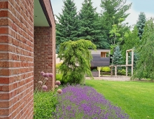 Linear perimeter planting along the house echoes the architecture, and offsets the custom play structure designed in collaboration with the client’s young son.