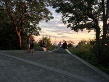 Landscaped halt at sunset showing granite border turning into low benches
