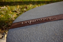 Each individual place-marker incorporates a bronze band with a word or phrase