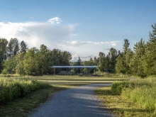 Shelter oriented with open field adjacent to park entry.