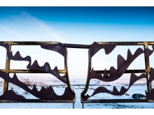 The gate latch incorporates Inuit symbols, welcoming visitors to the site