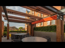 A retractable awning provides sun protection and privacy from the neighbours above.