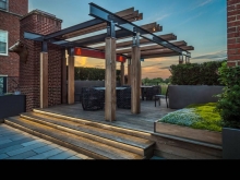 The arbour is designed to reflect forms and proportions found in the historically registered building with I beams and mechanical connections expressing local industry of this rust belt city.
